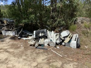 Six air conditioners and a washing machine were dumped at Coochin Creek.