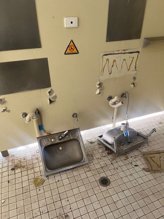 Photo of sinks that the vandals targeted in the toilet block.