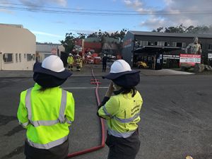 DES officers responding to the fire at a Gold Coast waste business.